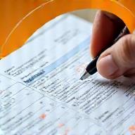 Close-up image of a detailed travel itinerary document being reviewed.